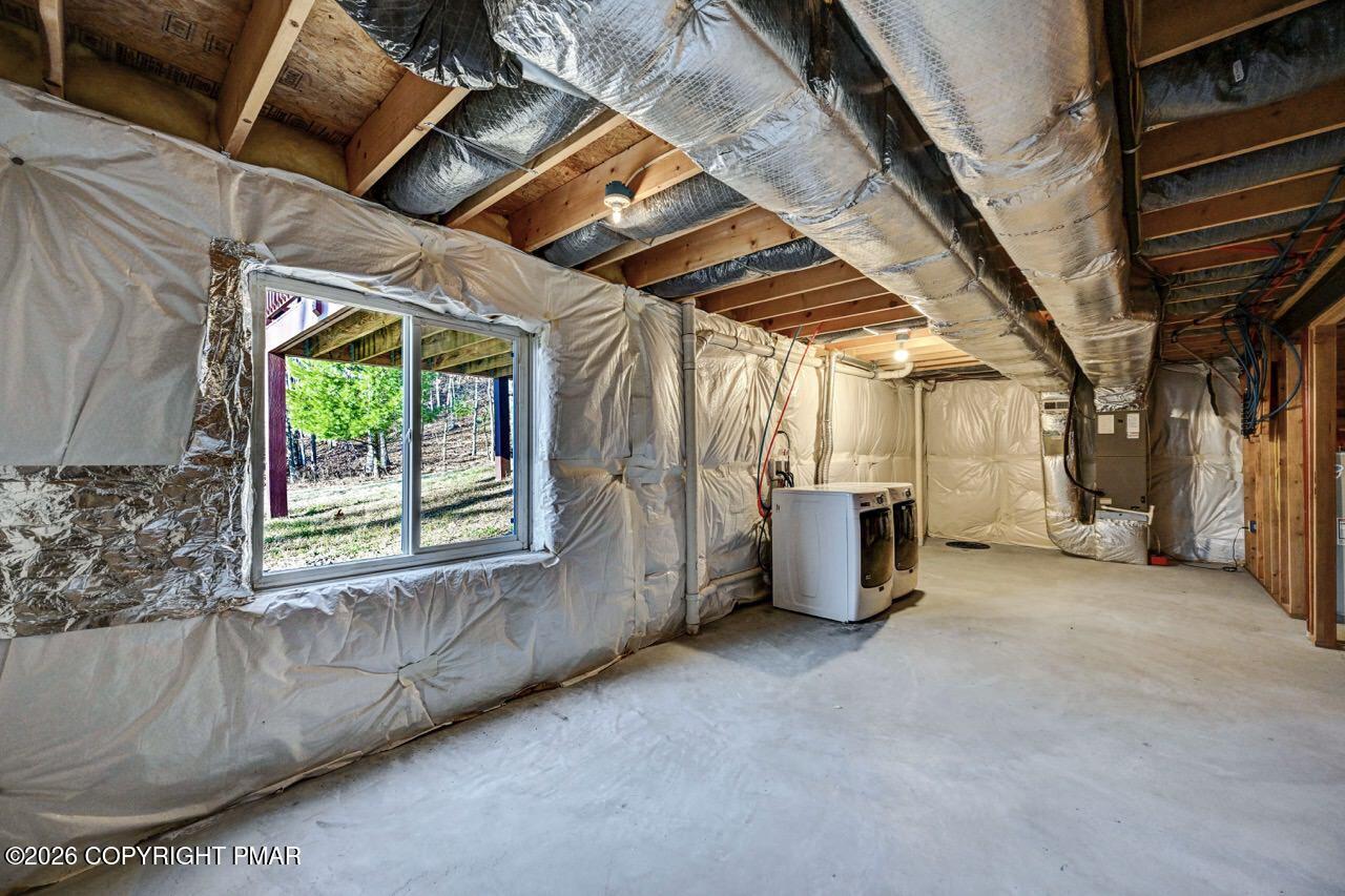 1013 Bear Swamp Road East Stroudsburg, PA 18302 - Photo 44 of 53 a view of a room with wooden floor and windows