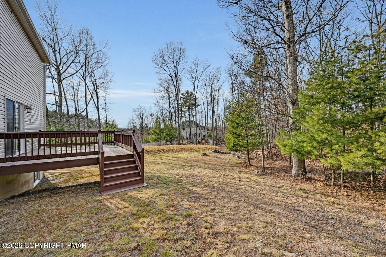 1013 Bear Swamp Road East Stroudsburg, PA 18302 - Photo 49 of 53 a view of stairs and trees with wooden fence