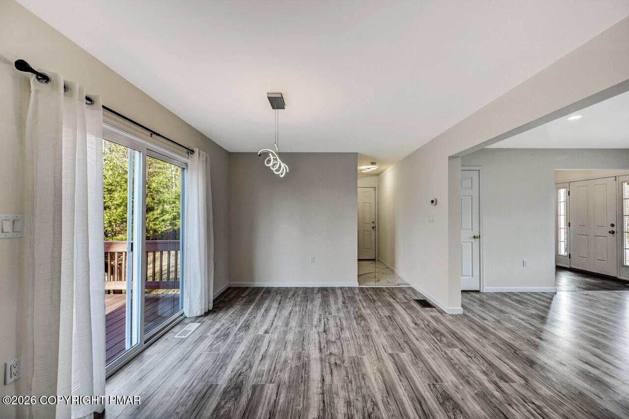 1013 Bear Swamp Road East Stroudsburg, PA 18302 - Photo 10 of 53 wooden floor in an empty room with a window