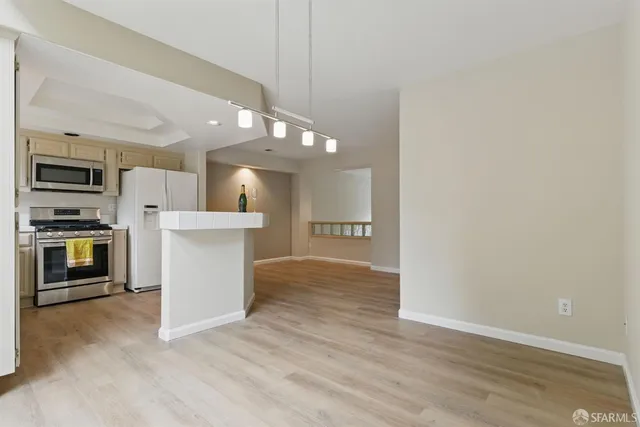 a view of a kitchen with a sink and an oven