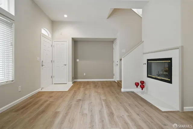 a view of livingroom with hardwood floor and hallway