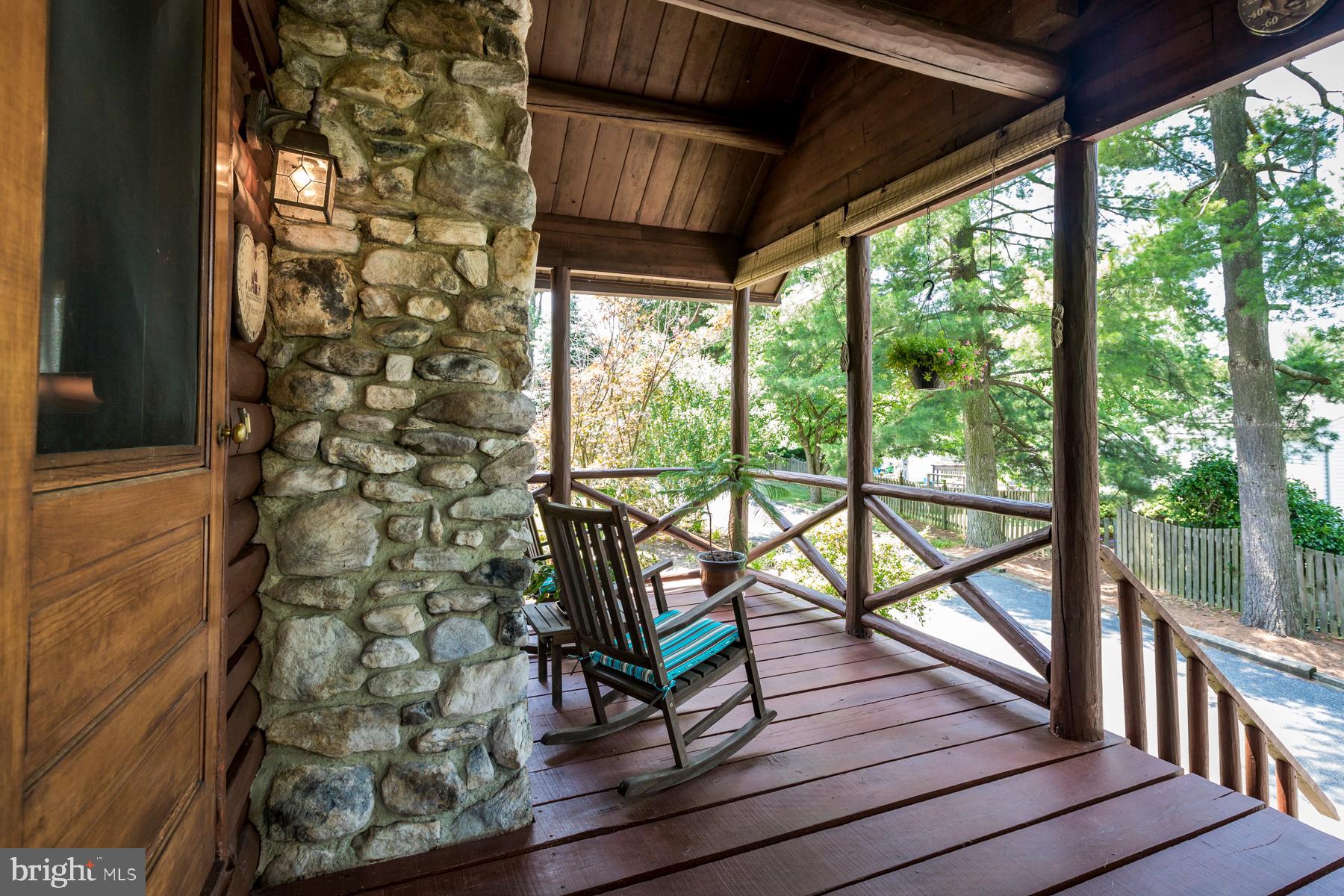 9732 Whiskey Bottom Road Laurel, MD 20723 - Photo 56 of 63 Side porch to die for shows off back of stone FP