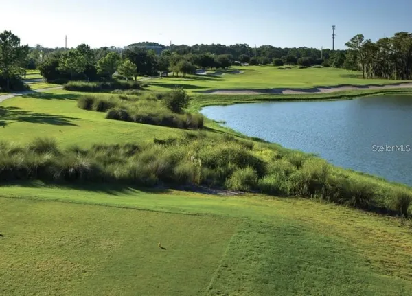 a view of a golf course with a lake