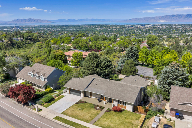3813 North Foothill Drive Provo, UT 84604 - Photo 69 of 71 Aerial perspective showcasing a residential property with a multi-gabled roofline and attached two-car garage