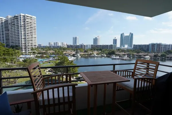 a view of a balcony chairs and a table and chairs