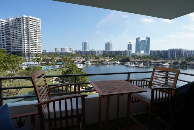 a view of a balcony chairs and a table and chairs