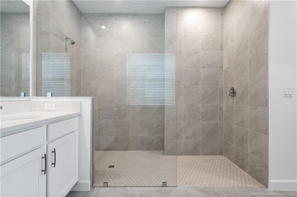 9731 Southwest Indra Way Port St. Lucie, FL 34987 - Photo 18 of 33 Primary Bath with Large Walk in Shower