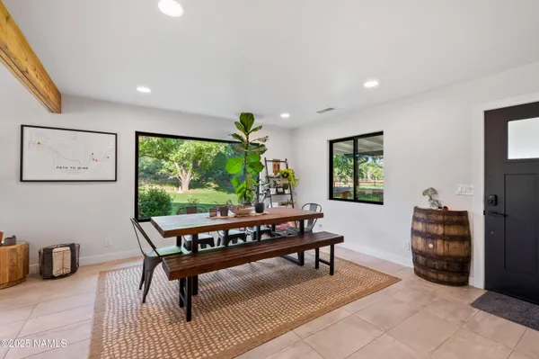 a living room with furniture a window and a table