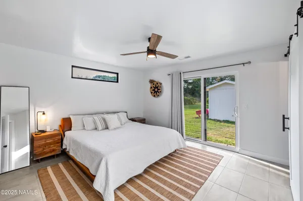 a bedroom with a bed and a walk in closet