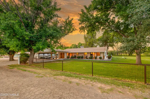 a view of a house with a big yard