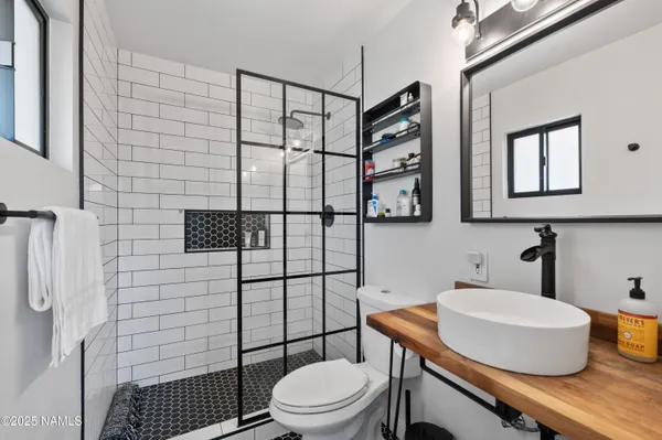 a view of a house with backyard and a tree