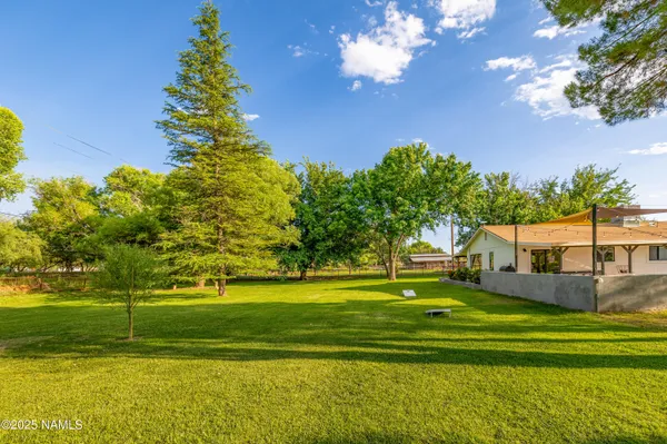 a view of a house with a big yard