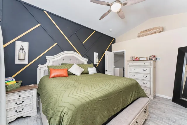 a living room with furniture a rug and a fireplace