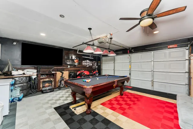 a view of yard with swimming pool and seating area