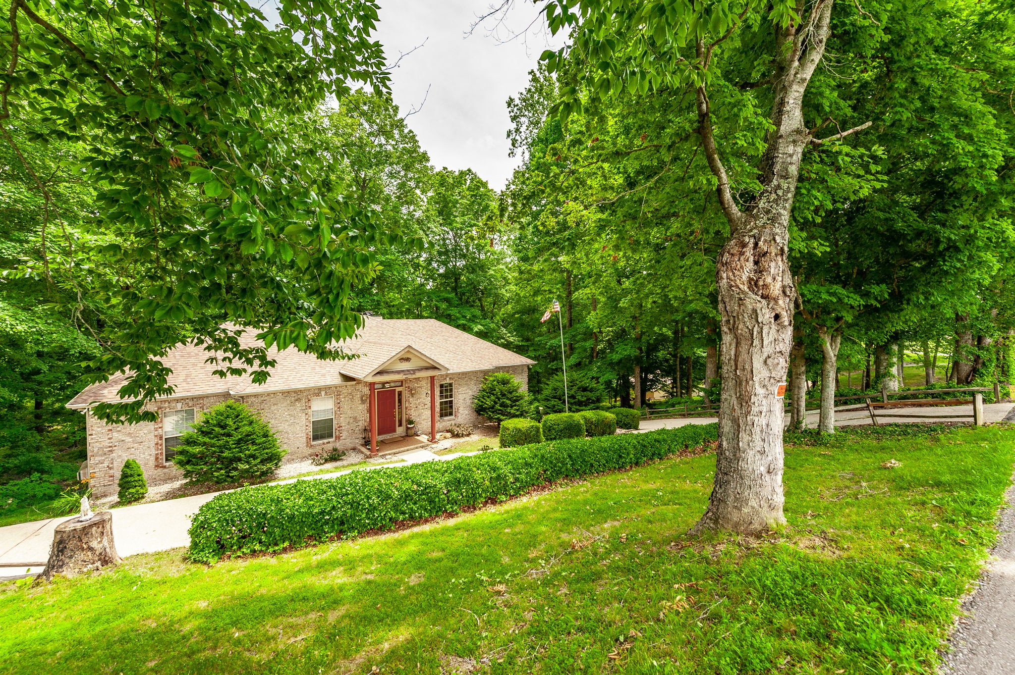 6513 North Mt Pleasant Road Greenbrier, TN 37073 - Photo 11 of 54 a house with green field in front of it