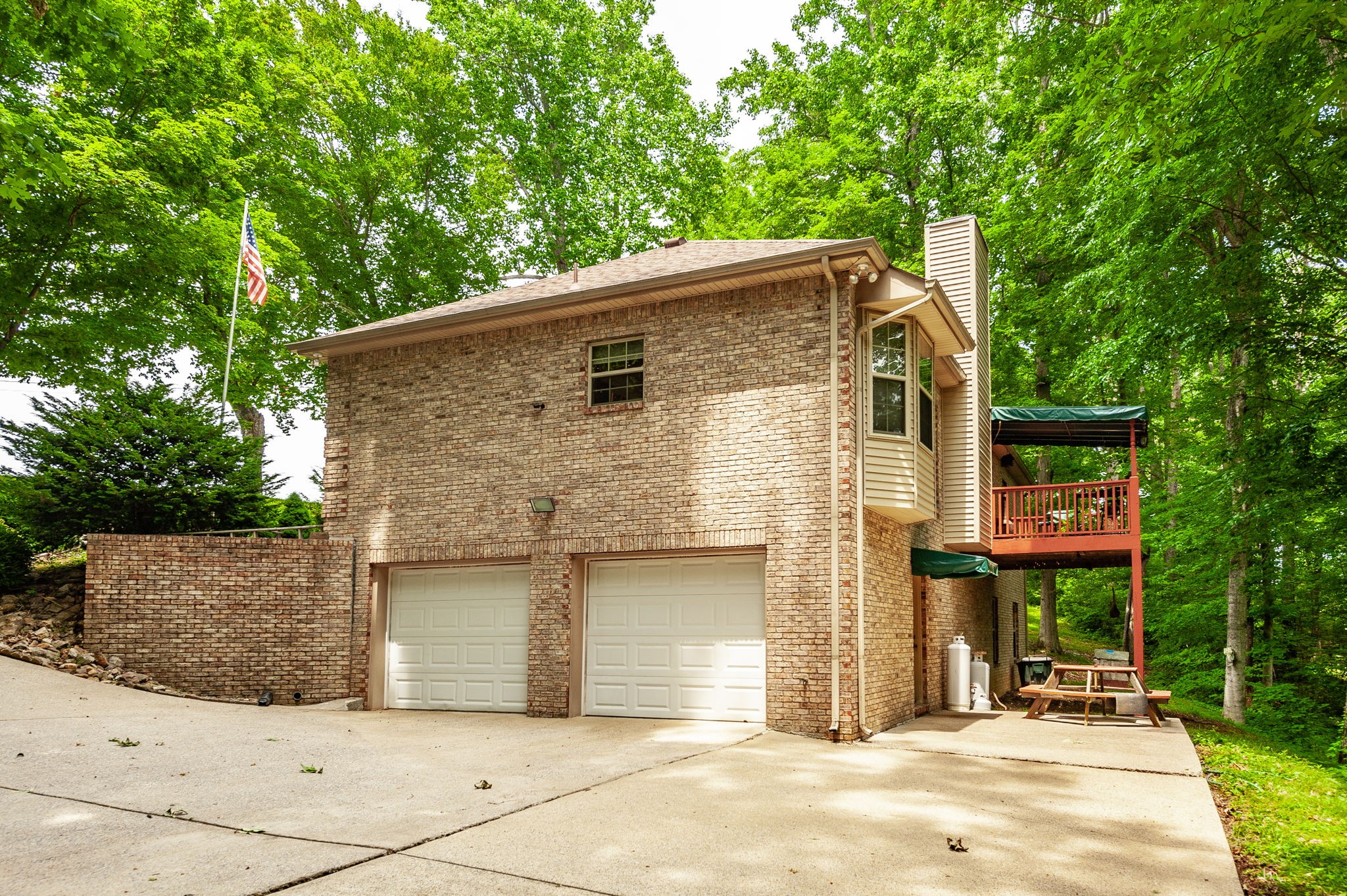 6513 North Mt Pleasant Road Greenbrier, TN 37073 - Photo 14 of 54 a backyard of a house with table and chairs