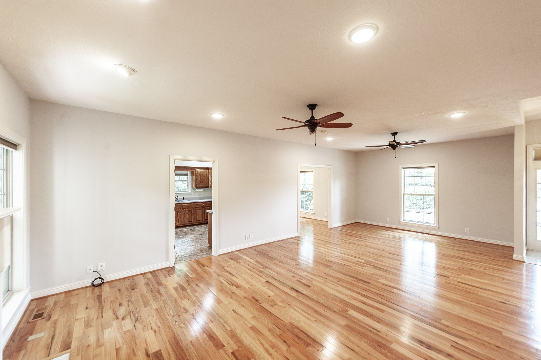 6513 North Mt Pleasant Road Greenbrier, TN 37073 - Photo 27 of 54 a view of empty room with wooden floor and fan