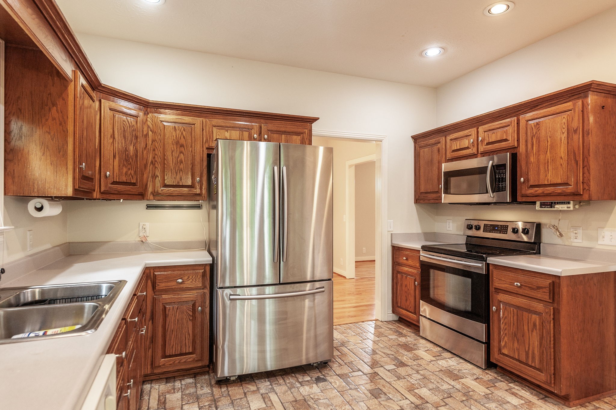 6513 North Mt Pleasant Road Greenbrier, TN 37073 - Photo 32 of 54 a kitchen with stainless steel appliances granite countertop a refrigerator stove and sink