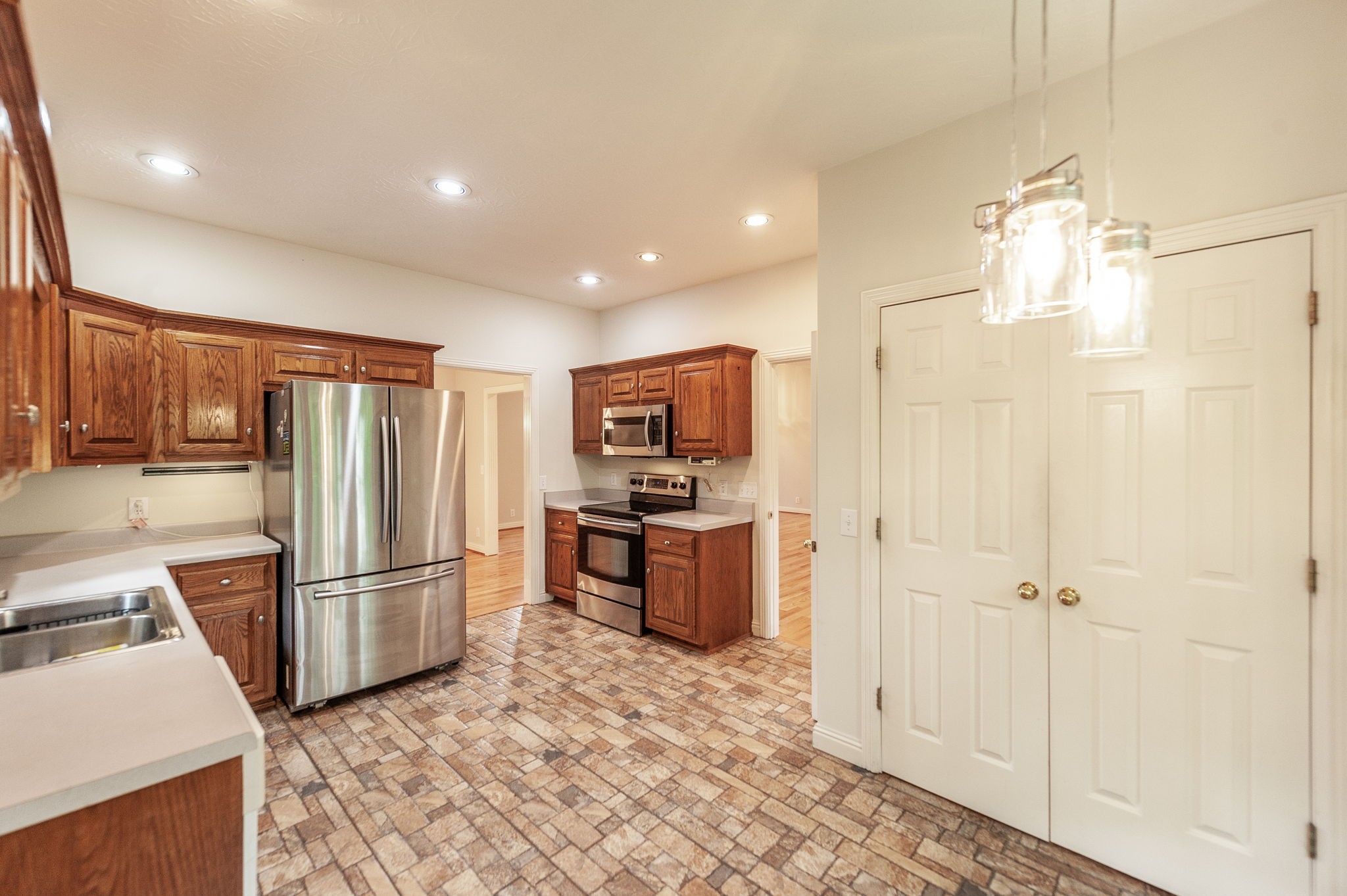 6513 North Mt Pleasant Road Greenbrier, TN 37073 - Photo 36 of 54 a kitchen with stainless steel appliances granite countertop a refrigerator and a stove top oven