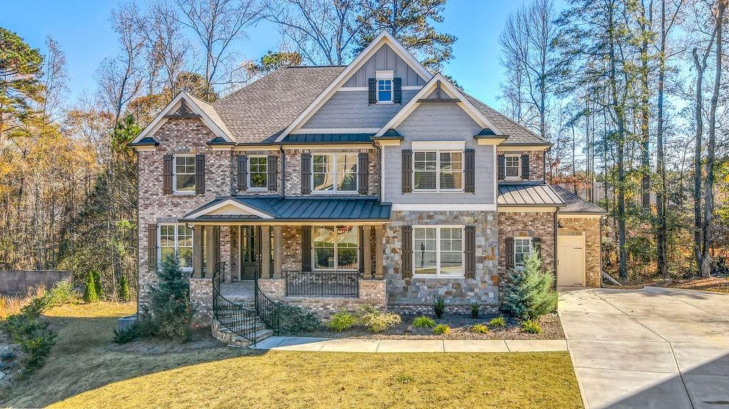 a front view of a house with garden