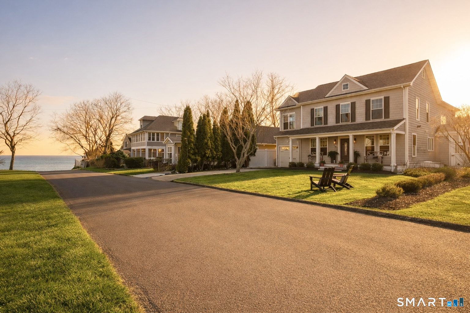 a view of residential houses with yard and swimming pool