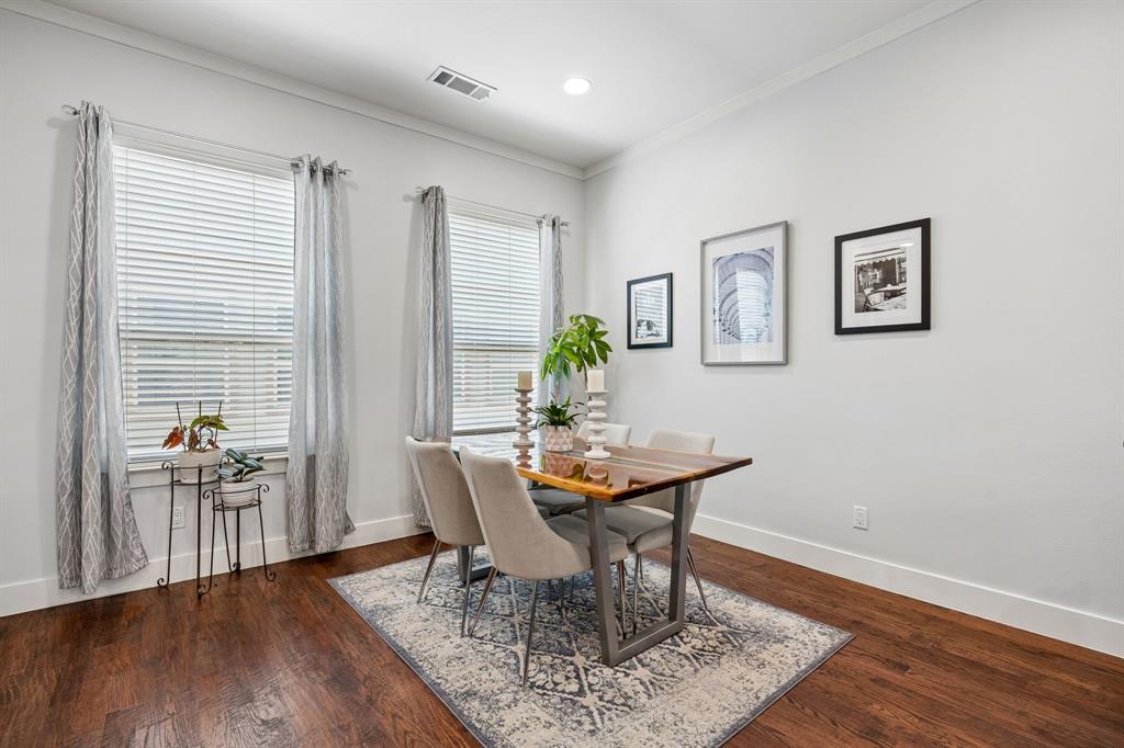 5875 Ross Avenue, Unit 9 Dallas, TX 75206 - Photo 9 of 29 Dining area featuring dark wood-style floors, crown molding and open to the kitchen and living area