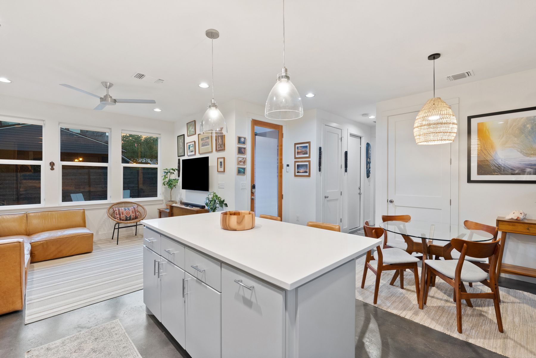 1709 Perez Street, Unit 2 Austin, TX 78721 - Photo 33 of 33 An open floorplan seamlessly connects the kitchen to the living area and dining nook, offering a bright and cohesive space.