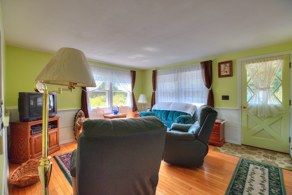 954 Chase Road Lunenburg, MA 01462 - Photo 11 of 27 a living room with furniture and a window