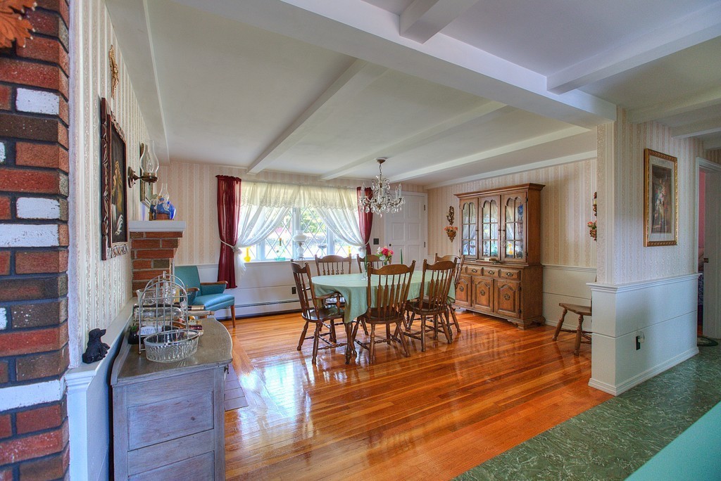 954 Chase Road Lunenburg, MA 01462 - Photo 12 of 27 a view of a dining room with furniture and wooden floor