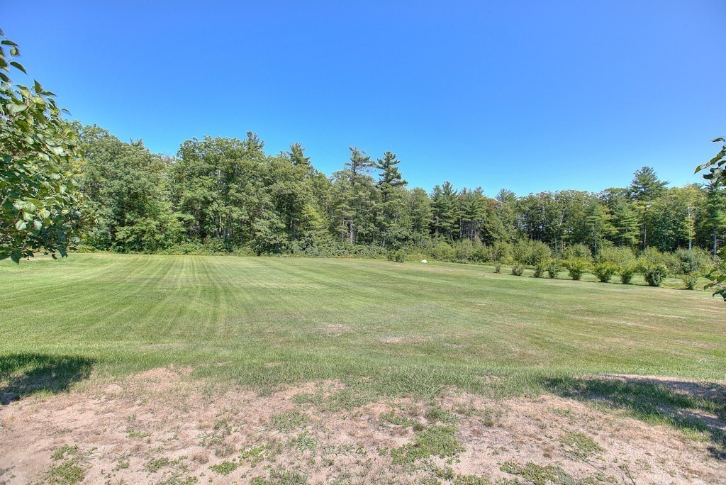 954 Chase Road Lunenburg, MA 01462 - Photo 19 of 27 a view of a field with an trees