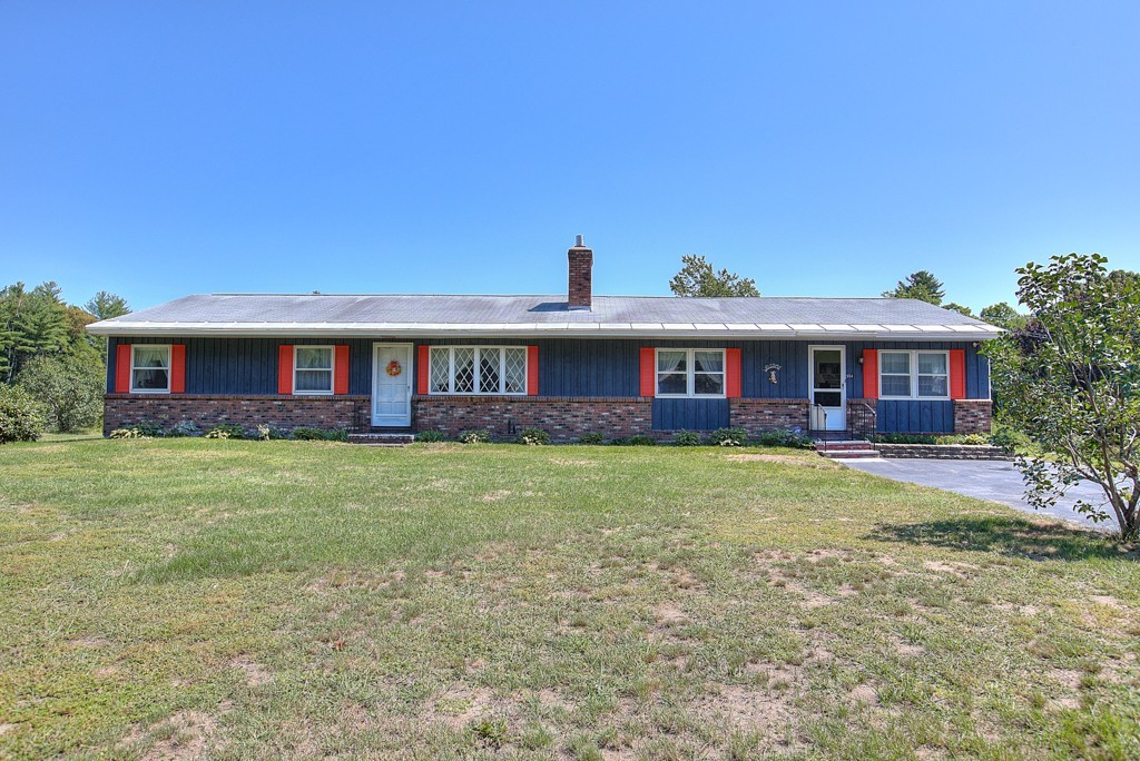 954 Chase Road Lunenburg, MA 01462 - Photo 2 of 27 a front view of a house with a yard