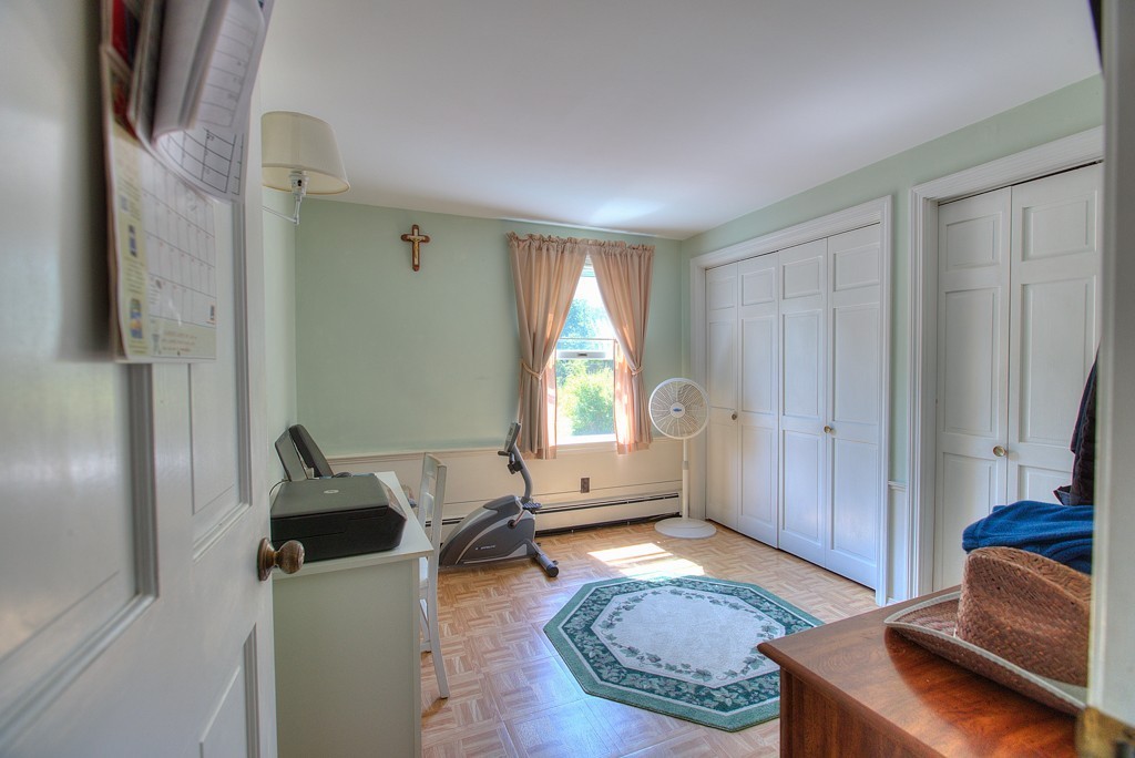 954 Chase Road Lunenburg, MA 01462 - Photo 23 of 27 a living room with furniture and a window