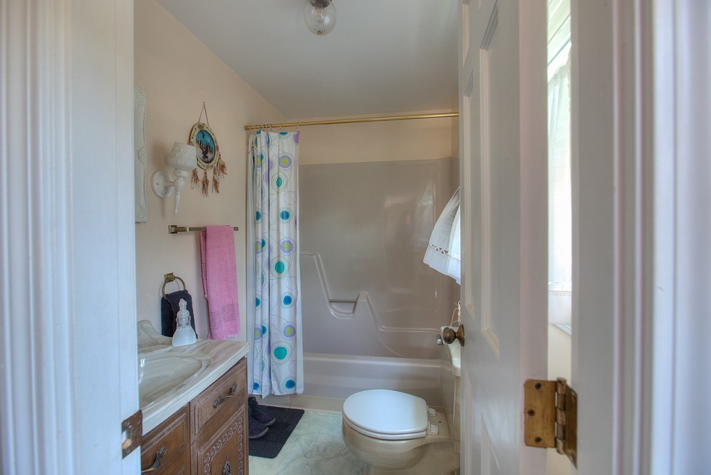 954 Chase Road Lunenburg, MA 01462 - Photo 24 of 27 a bathroom with a shower a toilet and a sink