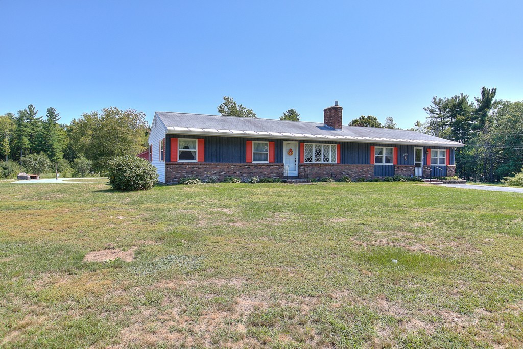 954 Chase Road Lunenburg, MA 01462 - Photo 3 of 27 a view of a house with a big yard and large trees