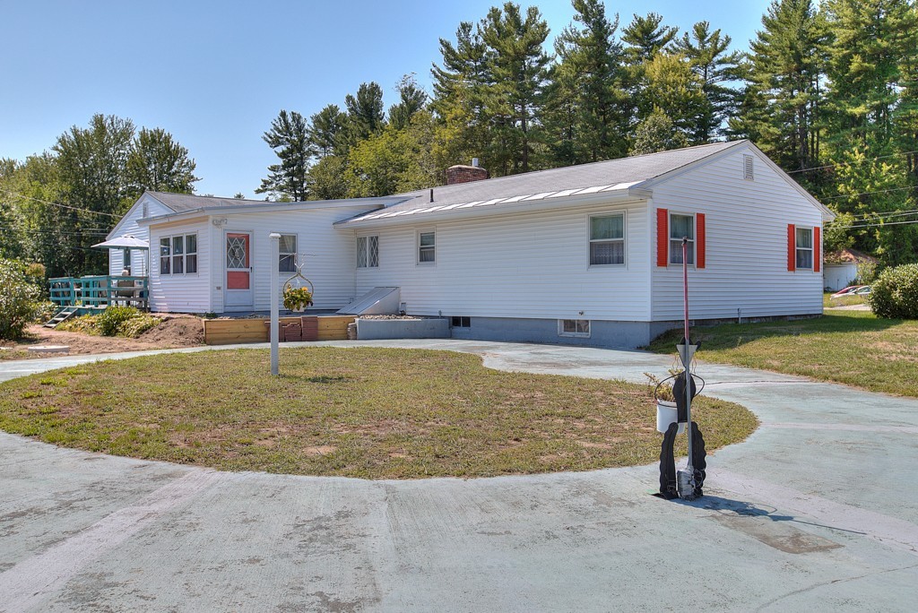 954 Chase Road Lunenburg, MA 01462 - Photo 4 of 27 a view of a house with backyard