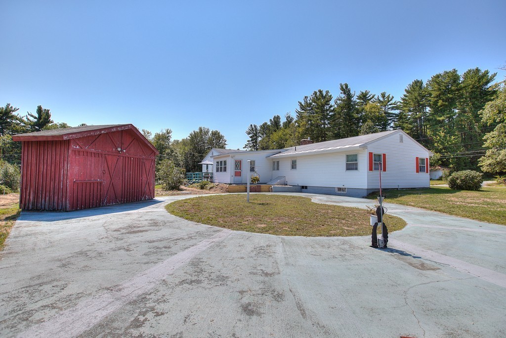 954 Chase Road Lunenburg, MA 01462 - Photo 5 of 27 a view of a house with backyard and trees