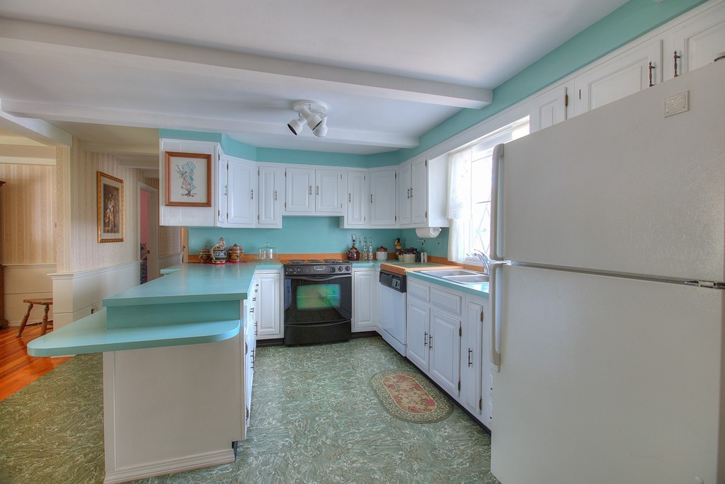 954 Chase Road Lunenburg, MA 01462 - Photo 6 of 27 a kitchen with sink cabinets and refrigerator