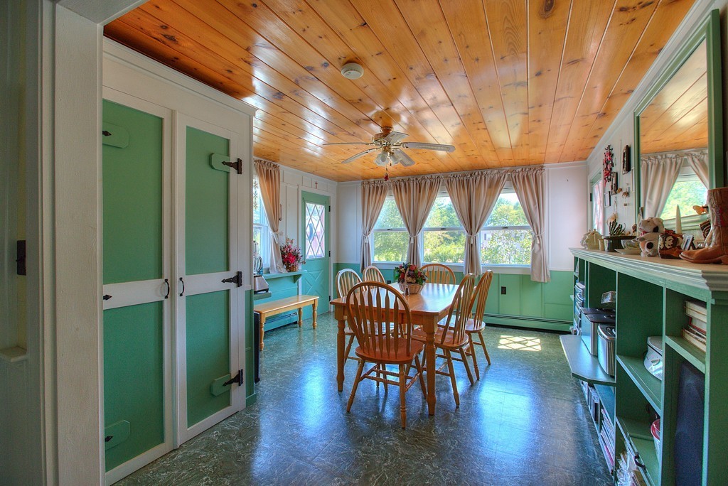 954 Chase Road Lunenburg, MA 01462 - Photo 8 of 27 a view of a dining room with furniture window and wooden floor