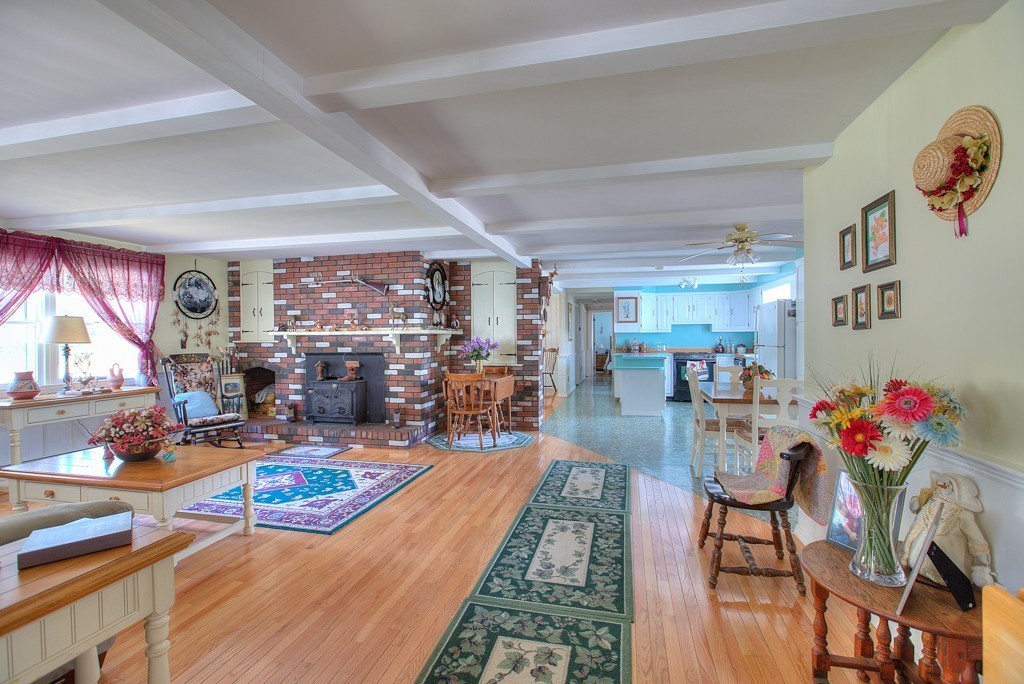 954 Chase Road Lunenburg, MA 01462 - Photo 10 of 27 a living room filled with furniture and a wooden floor