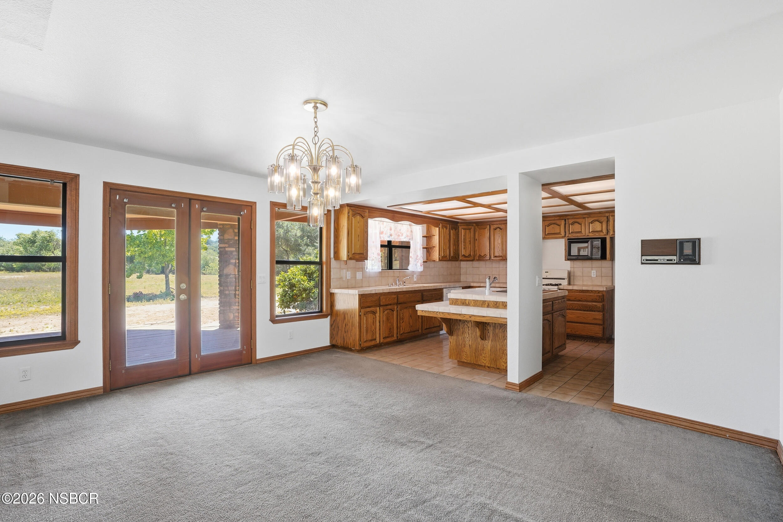 140 East Rice Ranch Road Santa Maria, CA 93455 - Photo 11 of 44 a big room with windows and chandelier