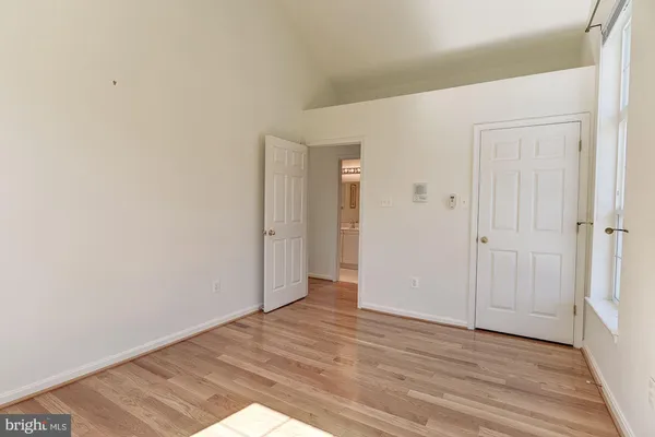 a view of walk in closet with clothes