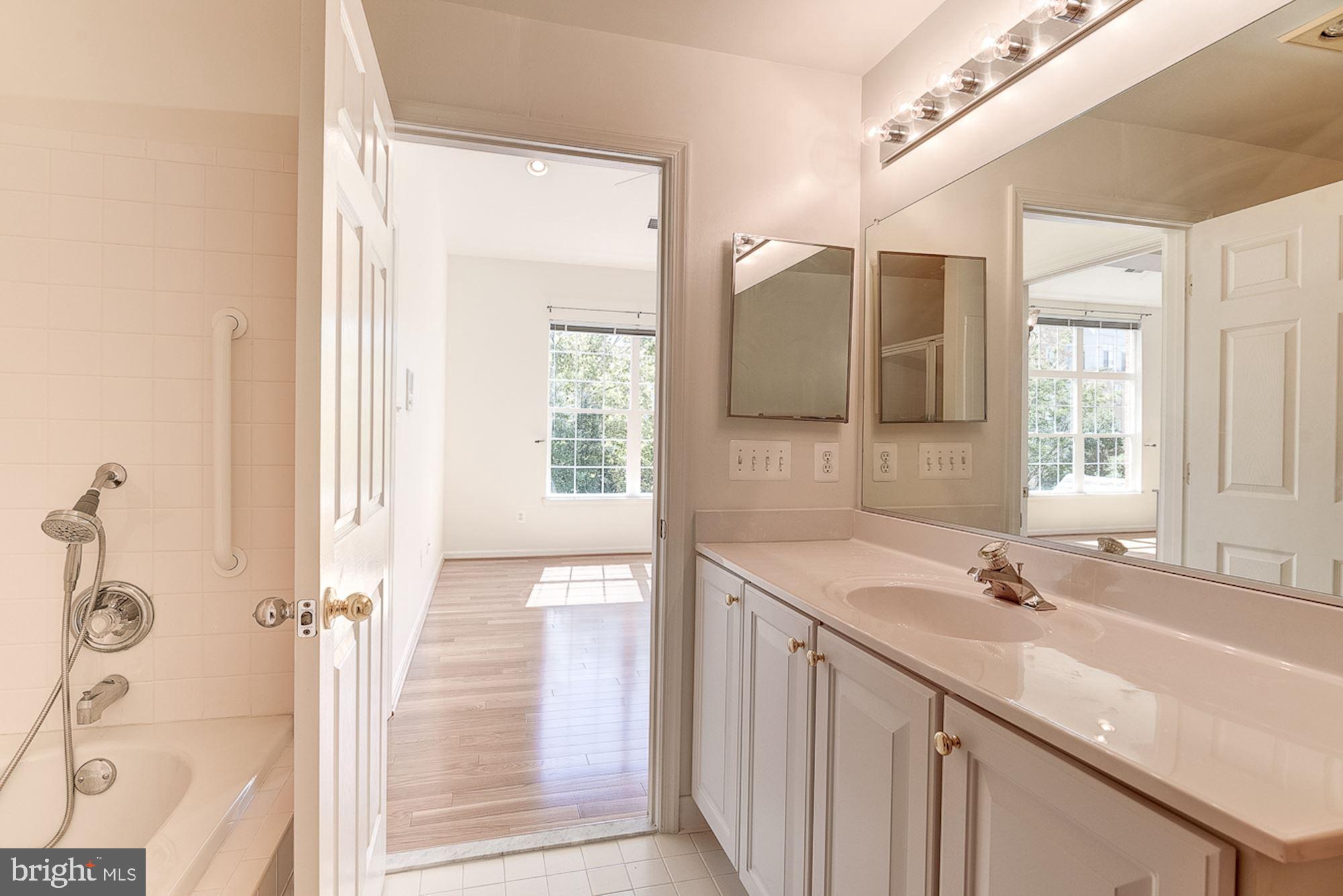 10706 Symphony Way, Unit 208 Columbia, MD 21044 - Photo 27 of 49 Primary Suite Bathroom