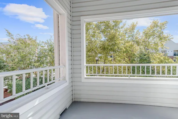 a view of balcony with furniture