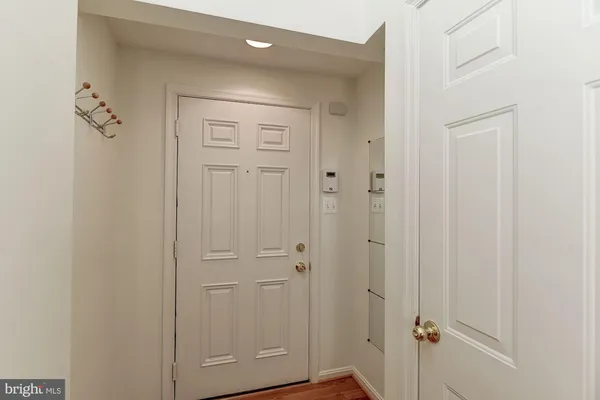 a view of entryway with wooden floor