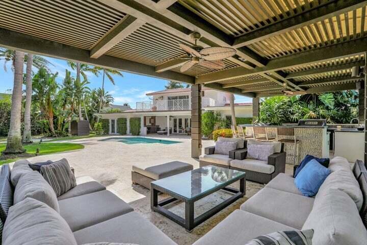 2100 Spanish River Road Boca Raton, FL 33432 - Photo 2 of 38 a patio with patio couch and outdoor seating
