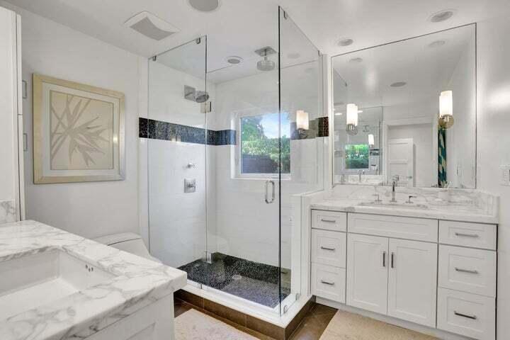 2100 Spanish River Road Boca Raton, FL 33432 - Photo 23 of 38 a bathroom with a granite countertop sink mirror and shower