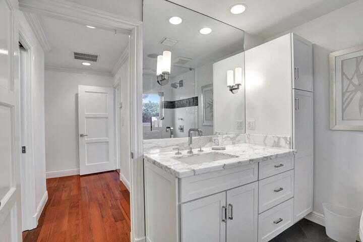 2100 Spanish River Road Boca Raton, FL 33432 - Photo 24 of 38 a spacious bathroom with a granite countertop sink mirror and shower