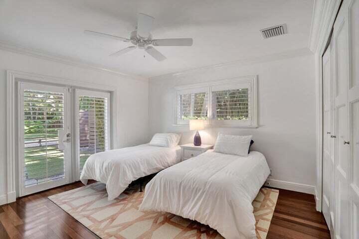 2100 Spanish River Road Boca Raton, FL 33432 - Photo 27 of 38 a bedroom with two beds and a large window