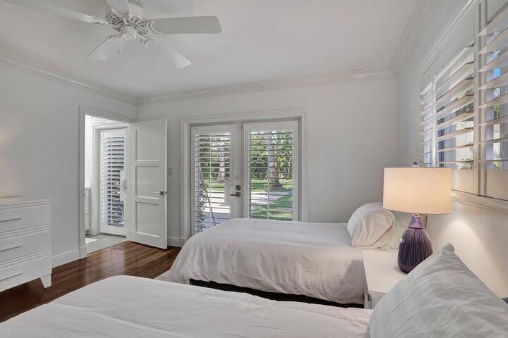 2100 Spanish River Road Boca Raton, FL 33432 - Photo 28 of 38 a bedroom with a large bed and a window
