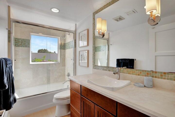2100 Spanish River Road Boca Raton, FL 33432 - Photo 29 of 38 a bathroom with a sink and a mirror